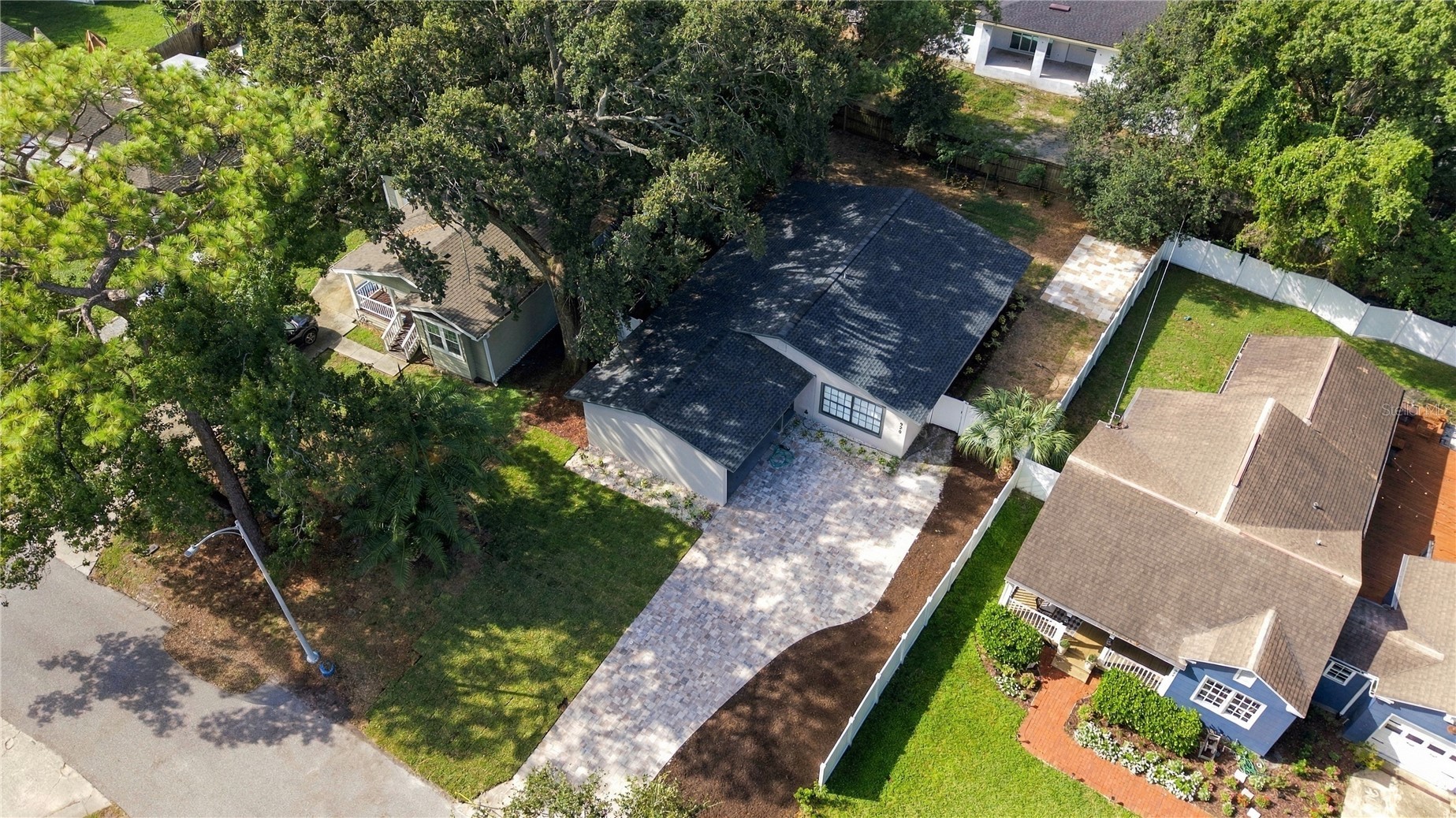 Aerial view of the home and its Wellswood setting